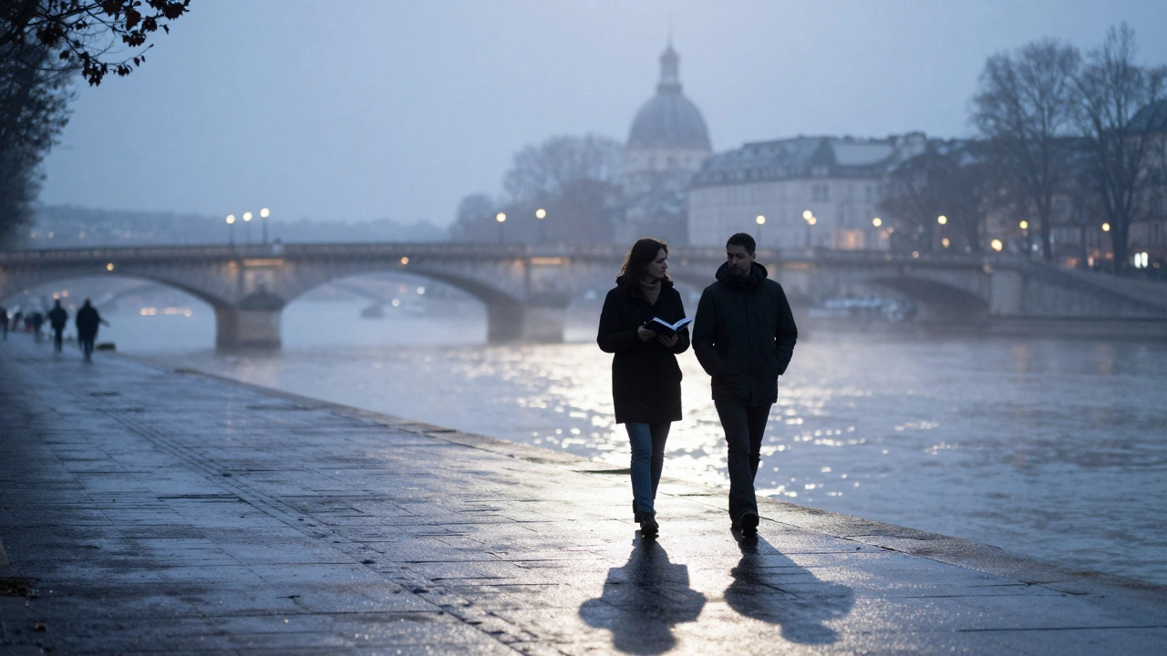 Silhouetted figures walking along the Seine at night, bridges glowing in the distance.